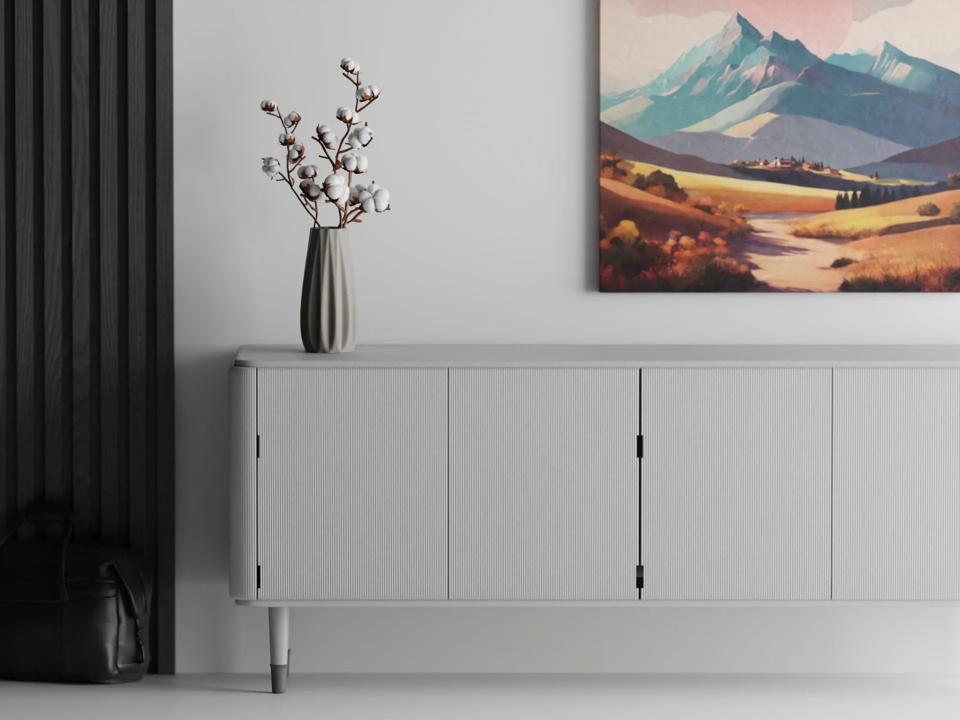 Minimalist interior with a ribbed 3D printed vase holding cotton stems on a white sideboard, beneath a colorful mountain painting